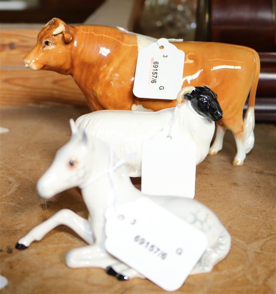 Beswick Guernsey bull, Ch. Sabrinas Sir Richard XIV, a seated grey foal, 915 & a black-faced ram (3)